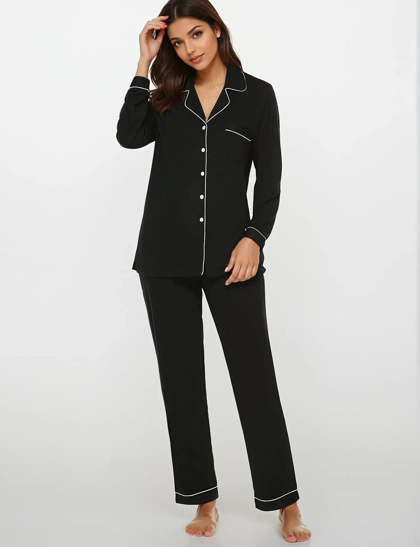 Front view of Prana Poshak black bamboo nightwear set for women – soft long-sleeve shirt with white piping and matching pajamas