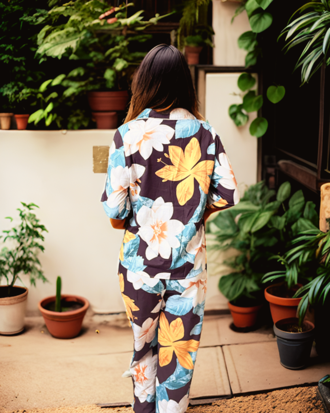 Back view of Prana Poshak's floral print pajama set, featuring a relaxed fit and sustainable fabric for comfortable loungewear
