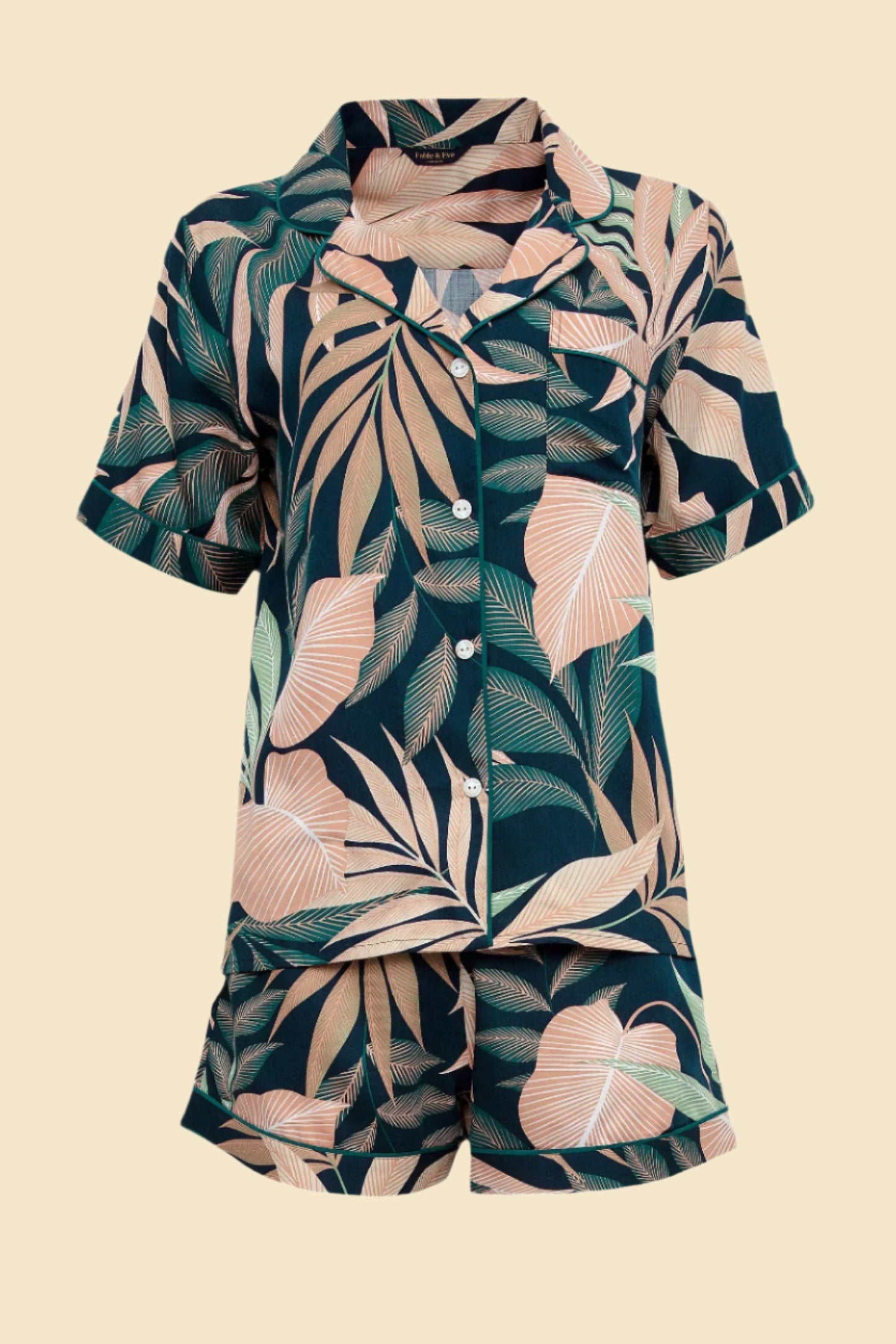 Close-up of the soft, breathable 60% modal and 40% cotton fabric used in Prana Poshak's leaf print shorty set.