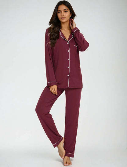 Model standing in maroon bamboo nightwear set – button-down shirt with classic piping, perfect for lounging by Prana Poshak