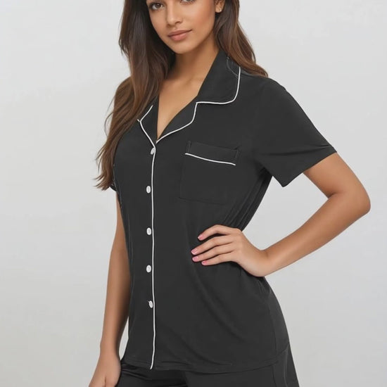 Model in motion wearing black bamboo short set by Prana Poshak – breathable, soft nightwear designed for everyday comfort