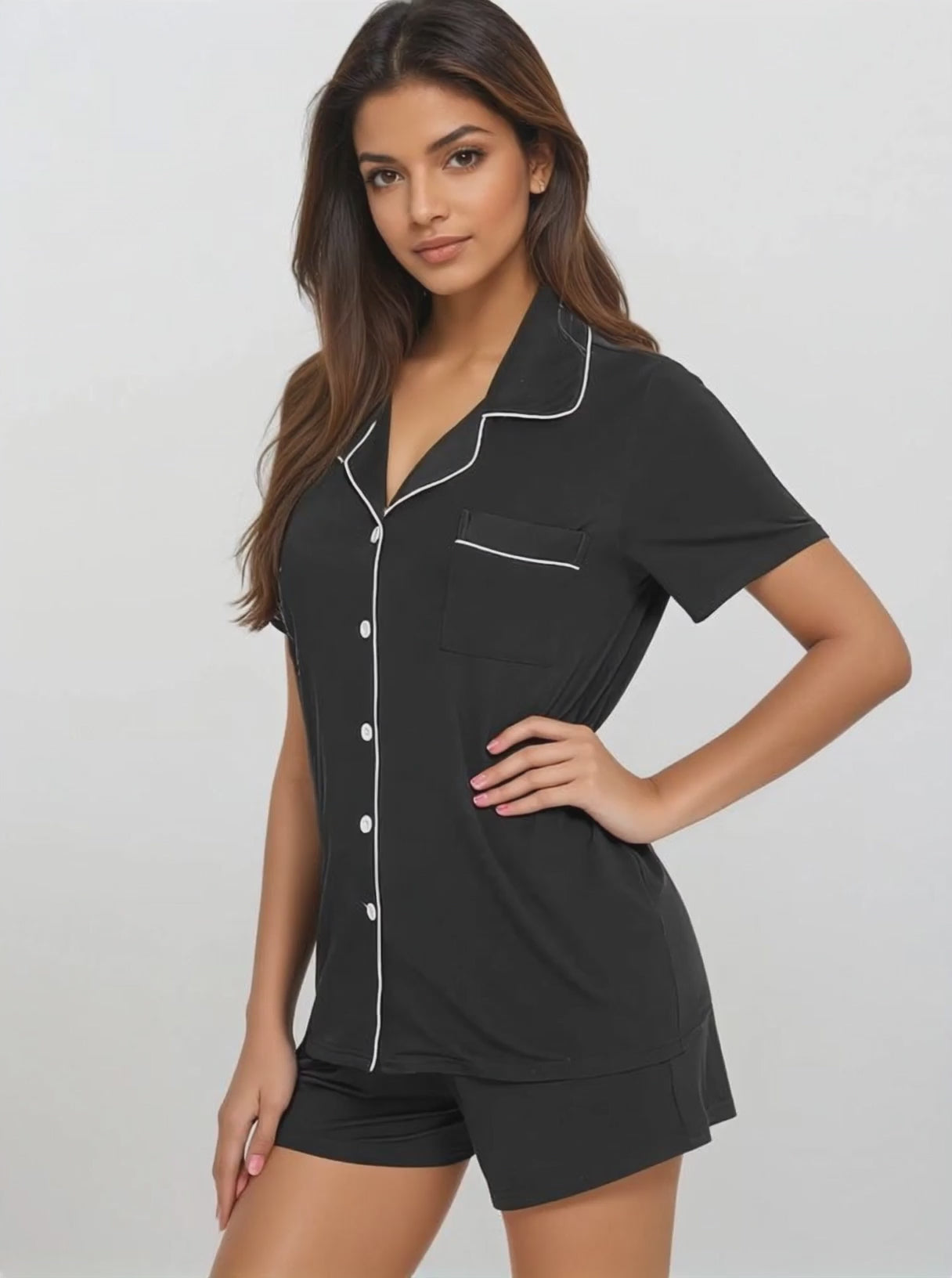 Model in motion wearing black bamboo short set by Prana Poshak – breathable, soft nightwear designed for everyday comfort